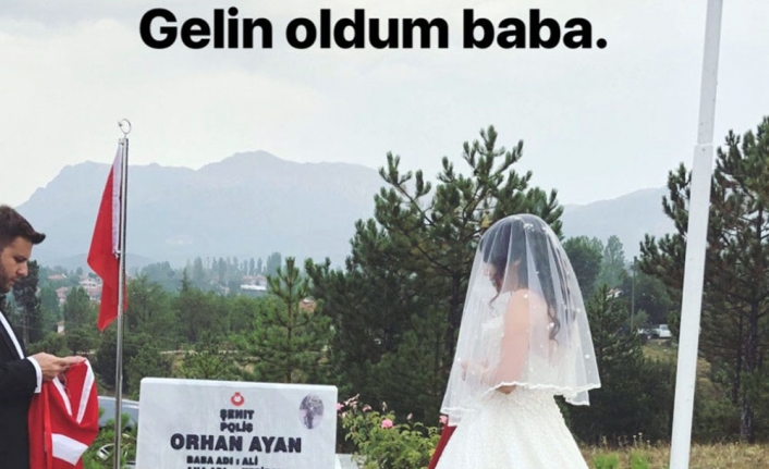 Gelinliğini giyip babasının mezarına gitti